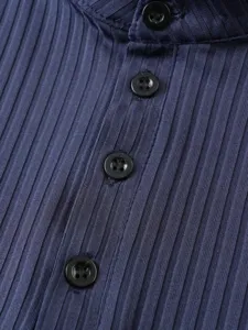 Detailed view of men's knitted ribbed tank top with button placket in dark blue texture.