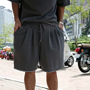 Detail view of men's casual short sleeve t-shirt and shorts set, loose fit, grey streetwear style.