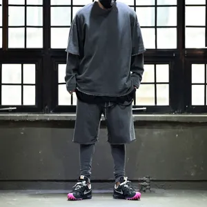Detailed view of men casual sportswear suit with layered short sleeve top and shorts.