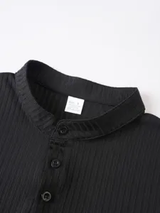 Men's black ribbed knit detail closeup view showcasing collar and button placket design