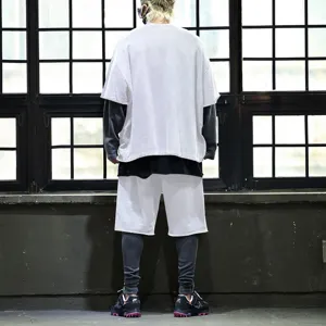Detail shot of men's casual loose short sleeve t-shirt and shorts set in street style.