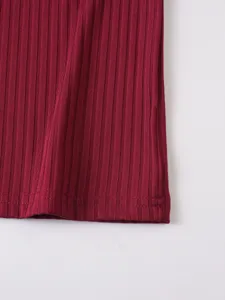 Men's knitted ribbed tank top detail view, close up showing the fine texture and neat hem stitching.