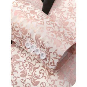 Detailed view of men's floral jacquard suit sleeve cuff with elegant pink and white design.