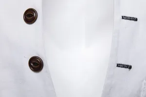 Vue en gros plan de la texture du tissu de veste de costume pour homme, boutons vintage.