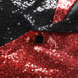 Close-up of men's color-blocked sequin suit jacket, showing sparkling fabric and button detail.