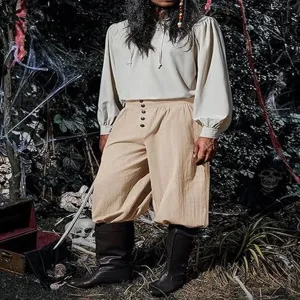 Medieval Renaissance men pirate pants scene detail, beige cotton linen loose cuffed trousers.