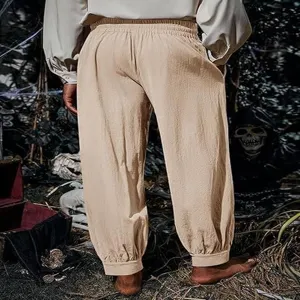 Detail shot of medieval Renaissance pirate trousers, loose cotton linen cuffed pants.