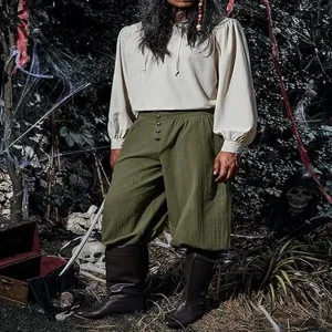 Detailed shot of mens medieval renaissance pirate pants, loose cotton linen trousers for costume.