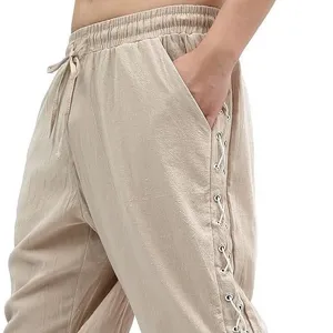 Men's casual tapered pirate pants with side lace-up grommets and drawstring waist.