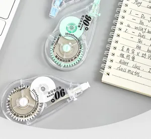Clear portable correction tape with 20mx5mm refill, 90 degree rotating tip detail view.