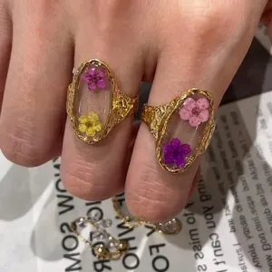 Handmade stainless steel ring with real dried flowers in clear resin setting for women