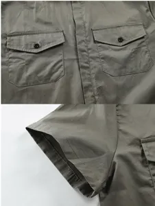 Men's military green utility jumpsuit detail view showing chest pockets and short sleeves.