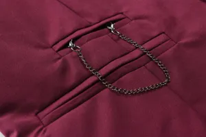 Detailed view of men's business casual suit vest pocket with chain decoration, burgundy fabric.