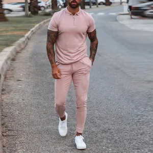 Men's two-piece short sleeve polo shirt and matching casual trousers set for summer fashion wear.