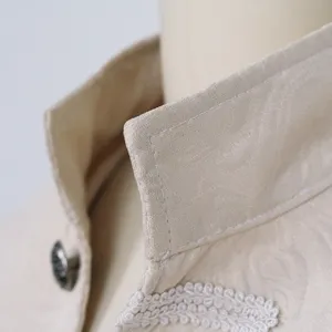 Close up view of the vintage men coat high collar, featuring exquisite white braid trim.