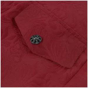 Close-up detail of men's vintage retro dark red patterned coat pocket with ornate metal button.