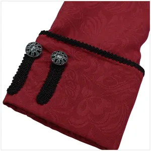 Close-up detail of vintage men coat red jacquard cuff with black trim and buttons.