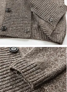 Close-up detail of mens knitted cardigan sleeve cuff and button design, textured wool fabric.