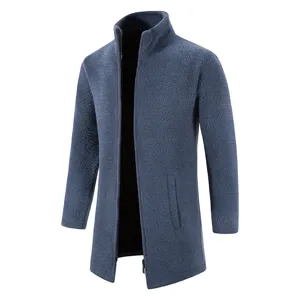 Men's dark blue fleece knit cardigan detail showing high collar, zipper, and soft texture.