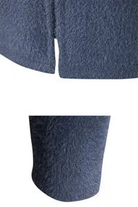Close-up fabric and hem slit detail of men imitation mink fleece knitted cardigan jacket.