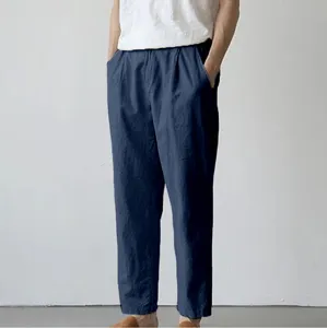 Close-up detail view of men's casual trousers featuring loose fit and comfortable fabric.