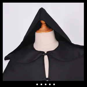 Detailed view of the black medieval hooded cloak showing the hood texture and toggle button.