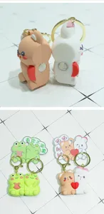 Cute cartoon PVC couple keychains with magnetic design, matching animal key rings for gifts.