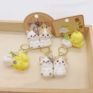 Cute cat and duck magnetic couple keychains set, PVC cartoon key rings for bags and car decor.