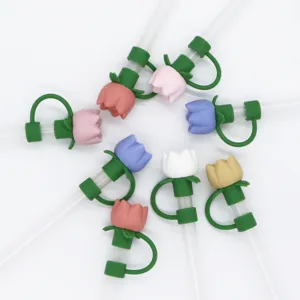 Detail shot of silicone tulip straw covers in various colors, showcasing the dustproof design.