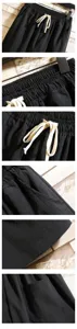 Men's casual solid color cotton linen shorts detailed close-up showing elastic waist and pockets