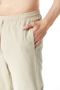 Pantalón casual de hombre de lino con cintura elástica y cordón, detalle de bolsillo.