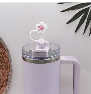 Silicone flower straw cap detail shot, cute cherry blossom straw topper for tumbler cup.