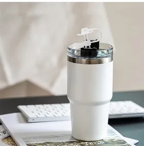 White stainless steel tumbler with cute cowboy hat silicone straw cover for daily use.