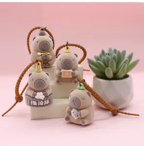 Cute flocked capybara keychain with silicone strap, creative animal pendant for car keys and bags.