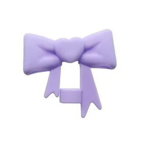 Purple silicone straw topper with cute heart bow design, perfect for 10mm tumblers.