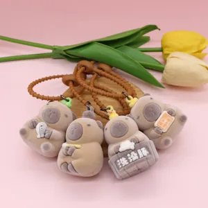 Cute flocked otter keychain set, creative plush animal pendant for car keys and bags.