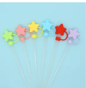 Colorful silicone star straw covers with transparent straws, cute dust-proof drinking straw tips.