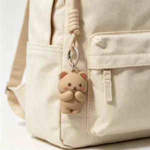 Cute 3D cartoon bear keychain detail shot, adorable bag pendant and key accessory item.