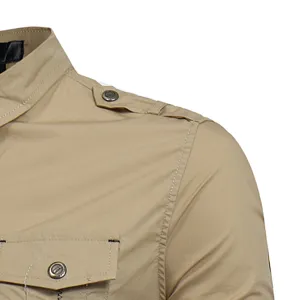 Detail shot of men's casual khaki utility long-sleeve cotton shirt with chest pocket.
