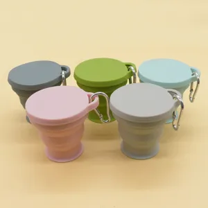 Portable collapsible silicone travel water cup with carabiner, compact 180ml folding design.
