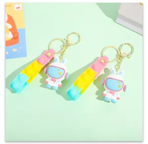 Cute cartoon space rabbit keychain with pop it bubble strap, PVC astronaut bag pendant.