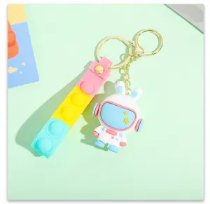 Cute cartoon astronaut rabbit keychain detail, creative pop it silicone strap, metal ring.