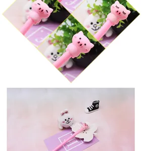 Cute cartoon gel pen detail with a lovely pink pig topper and cute stationery setup.