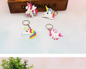 Cute cartoon unicorn PVC soft rubber keychain detail view, featuring colorful mane and metal ring.