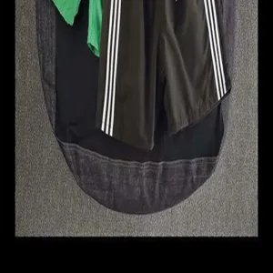 Summer casual sports shorts for men and women, classic three-stripe design, comfortable fit.