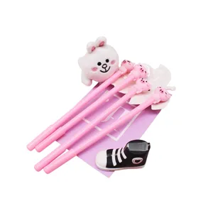 Cute cartoon gel pens set with 3D pig toppers and plush rabbit decor for student stationery.