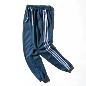 Pantalon de survêtement décontracté pour homme sportswear stylé avec bandes larges bleus