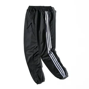 Pantalon de survêtement décontracté pour homme, pantalon noir avec bandes blanches.
