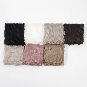 Detailed view of lightweight pleated solid color scarves in various colors for women.