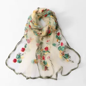 Exquisite floral embroidered sheer scarf detail, lightweight polyester shawl for women's stylish wear.